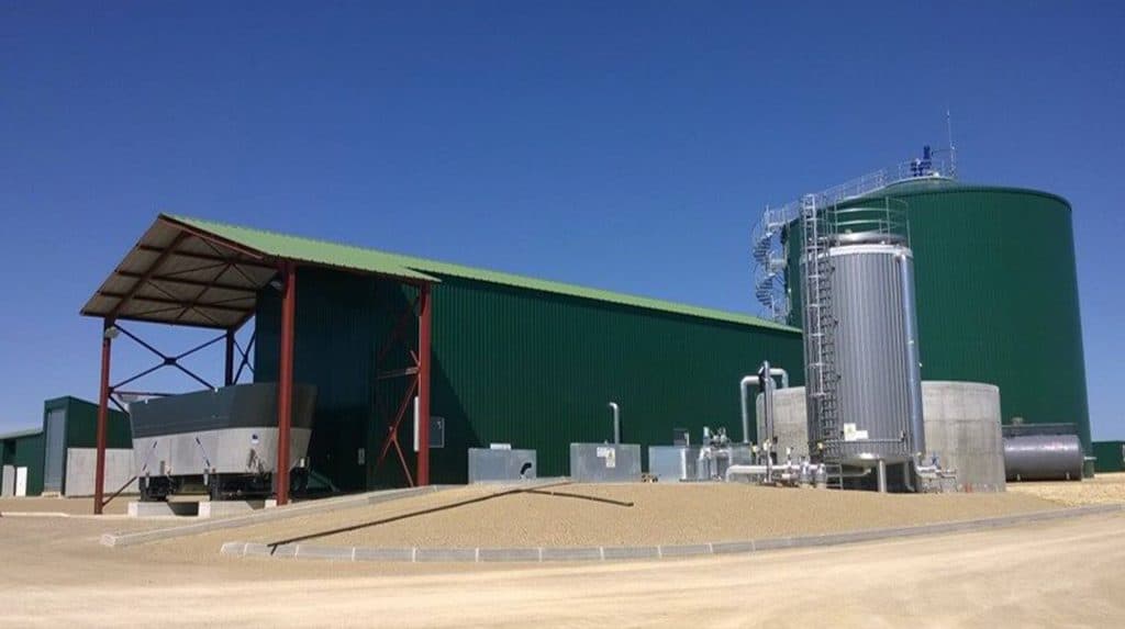 Green biogas chamber next to lorry depot